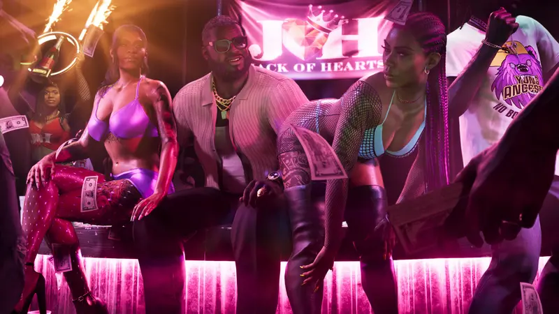 Boobie Ike seated between dancers inside the Jack of Hearts