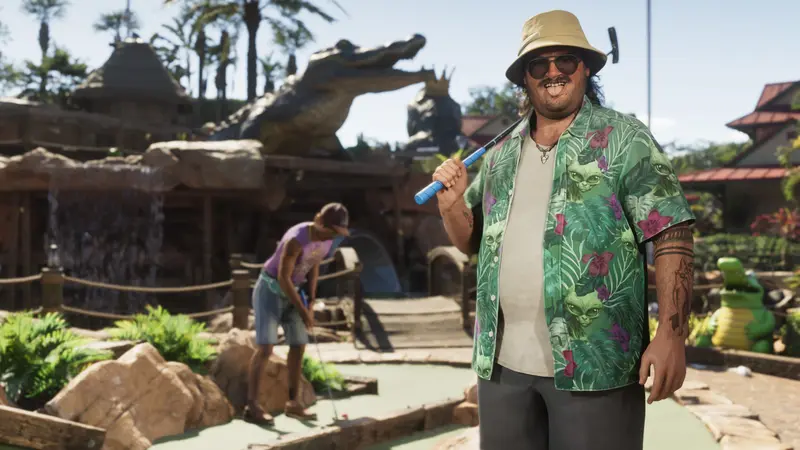Cal Hampton with a club at a mini-golf course