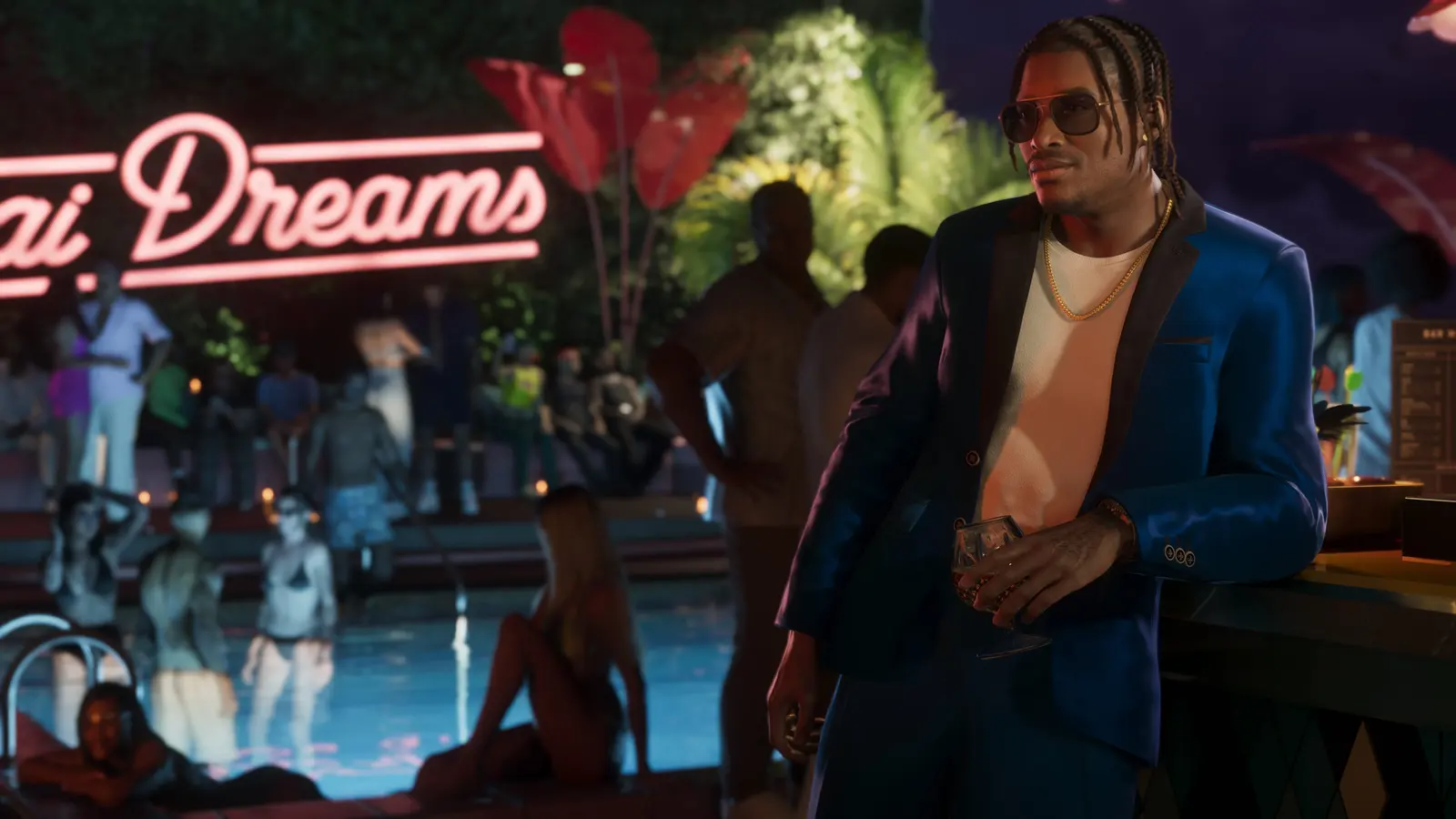 Dre'Quan Priest in a blue suit at a neon-lit pool party at night