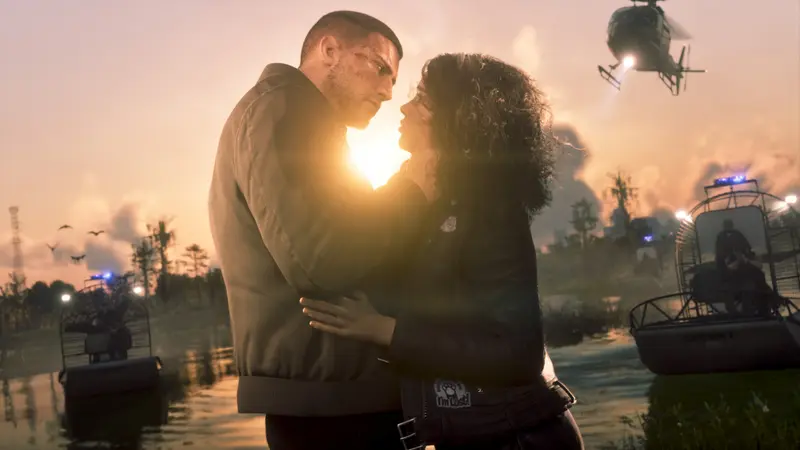 Jason and Lucia embrace at sunset in the wetlands as airboats and a helicopter close in