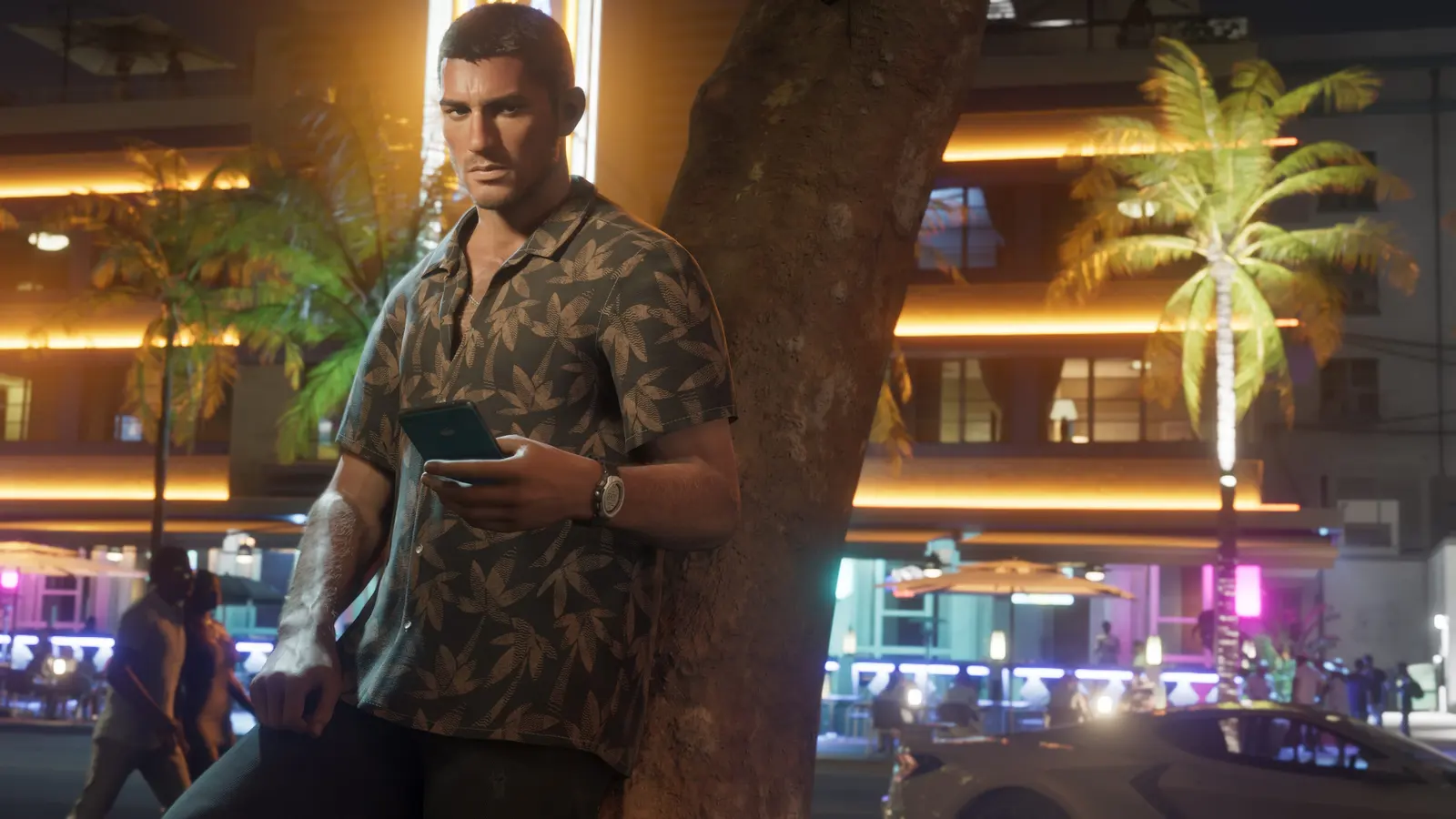 Jason Duval leaning on a palm tree on a neon-lit Vice City street at night, checking his phone