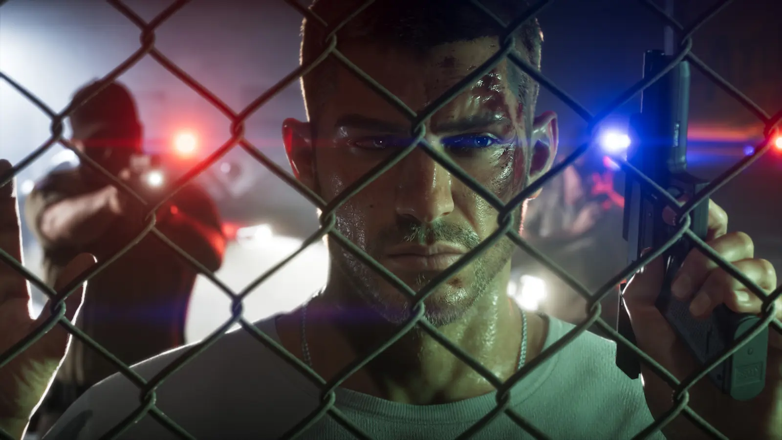Jason Duval behind a chain-link fence with police lights behind him, official GTA 6 screenshot