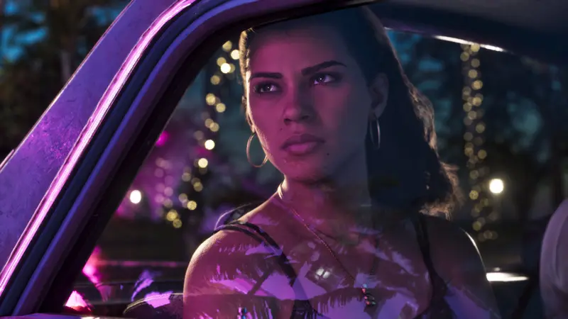 Lucia Caminos in a car at night under neon lights