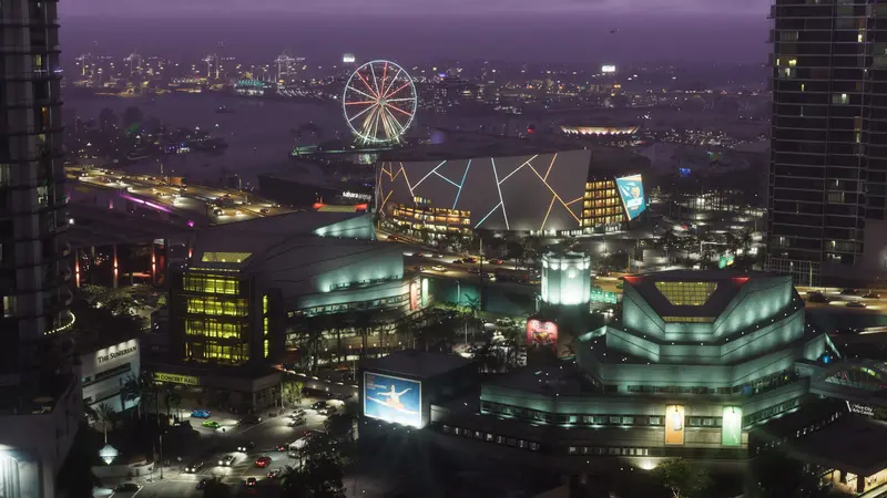 Vice City at night with a Ferris wheel and an arena
